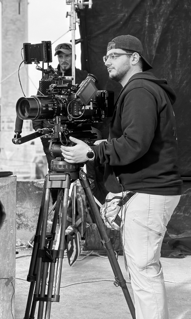 Anas Zaitoun working with a cinema camera on set